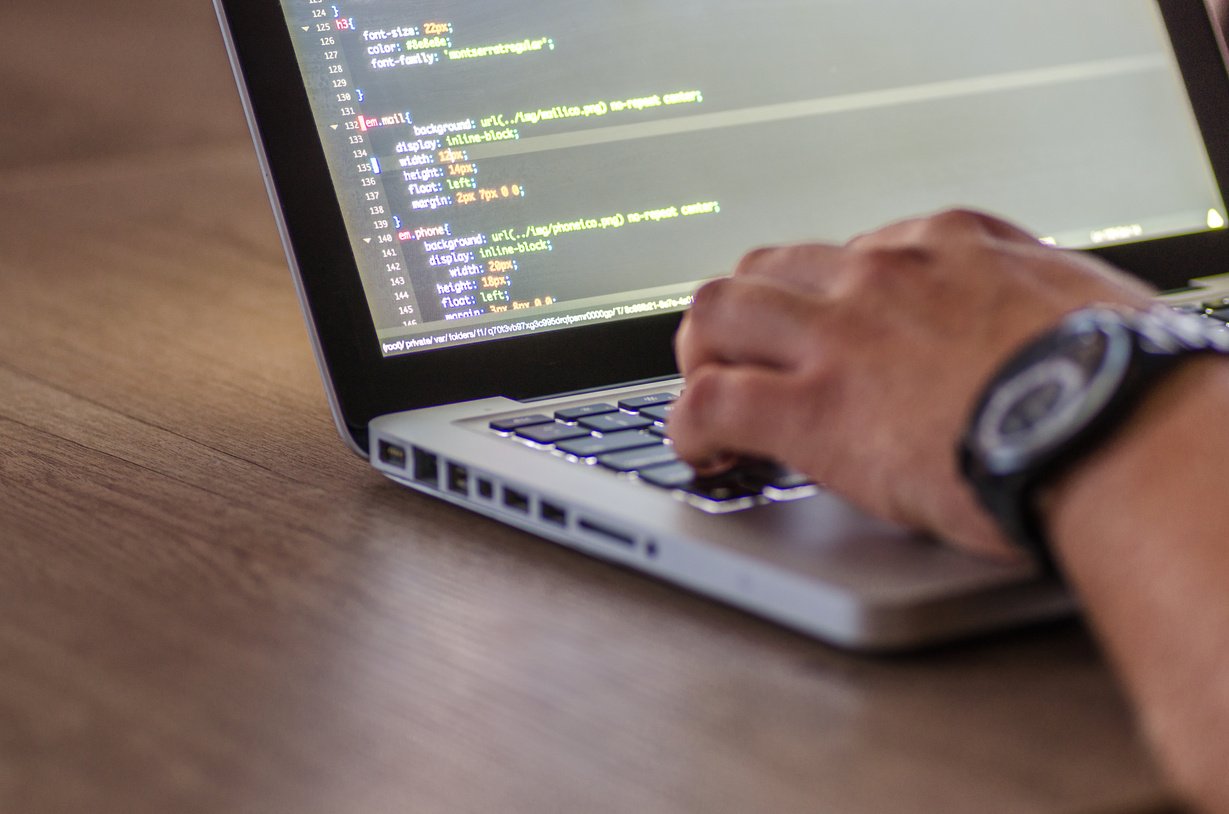 Man Working on Laptop in Office